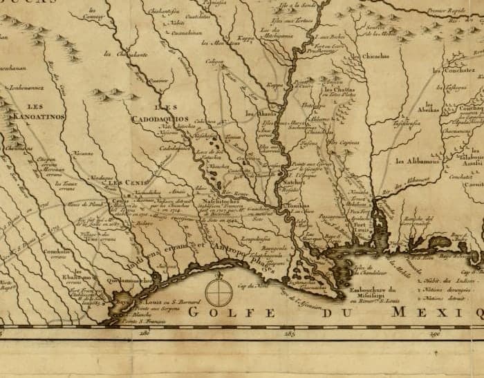A detail from Guillaume De l'Isle's 1717 map of Louisiana, showing Natchitoches named on the Red River with a note recording the French post, the Mississippi delta to the east, and the Gulf of Mexico along the foot of the sheet.